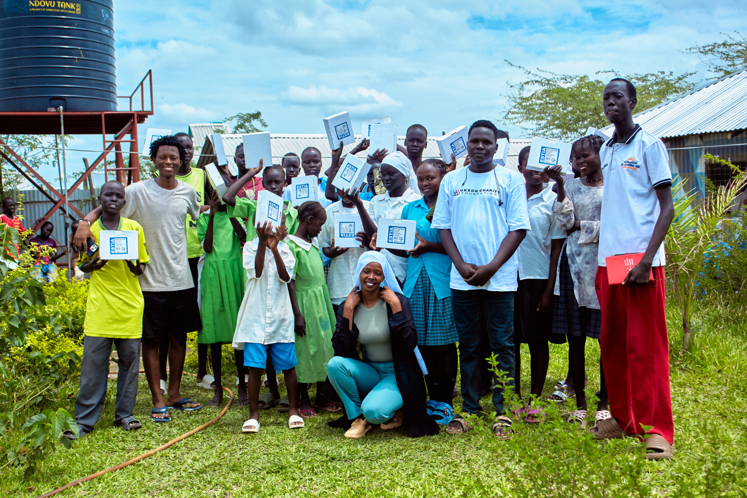 Donating solar lamps to leaners.